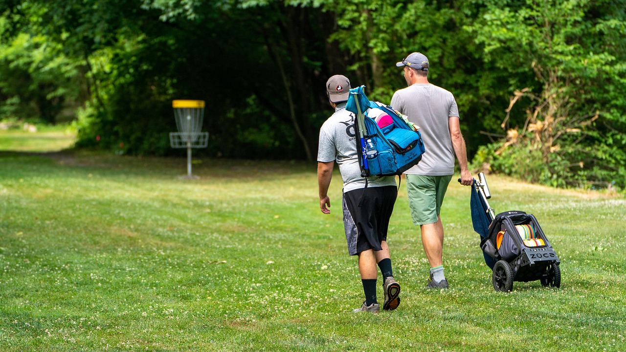two guys on disc golf course